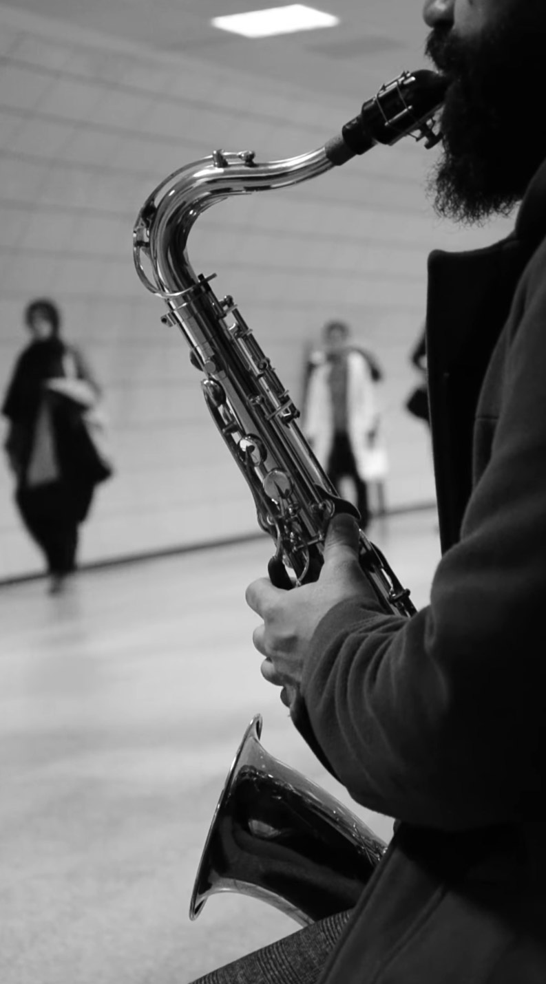 Busking-saxophone-webm-vertical